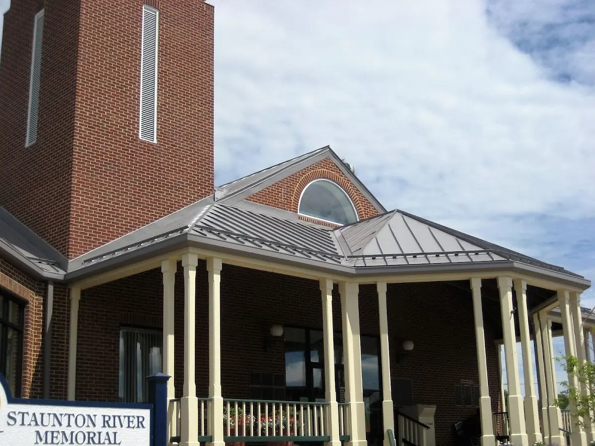 Skilled roofing craftsmen working on a residential roof in Dominion